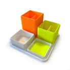 Der Organizer Yon Limited Edition NEON von Smartfurniture GmbH ist ein weißes Tablett mit vier gerippten, quadratischen 3D-gedruckten Behältern in Orange, Gelbgrün und Weiß - perfekt für eine stilvolle Schreibtischorganisation.
